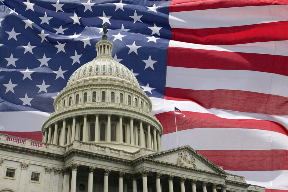 US Capitol with American flag backdrop