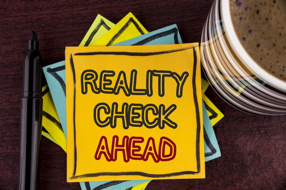 Writing note showing Reality Check Ahead. Business photo showcasing Unveil truth knowing actuality avoid being sceptical written on Sticky Note paper on Wooden background Coffee Cup and Marke